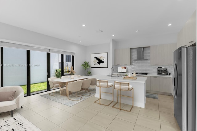 8271 NW 48th Ter, Doral, FL 33166 - kitchen with freestanding refrigerator, wall chimney range hood, open floor plan, light countertops, and decorative backsplash