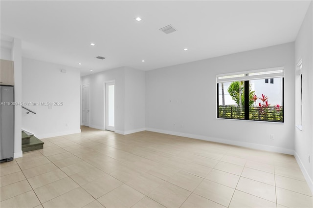 8271 NW 48th Ter, Doral, FL 33166 - unfurnished room featuring light tile patterned floors, stairway, recessed lighting, and baseboards