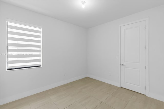 8271 NW 48th Ter, Doral, FL 33166 - spare room featuring baseboards and light tile patterned floors