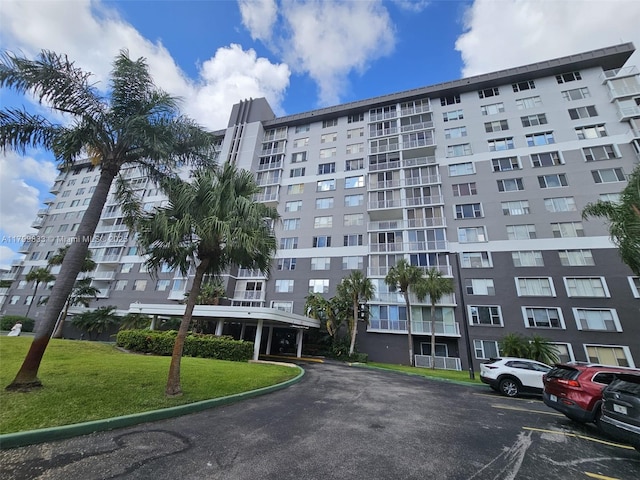 3850 Washington St Unit 704, Hollywood, FL 33021 - view of apartment building / complex with uncovered parking