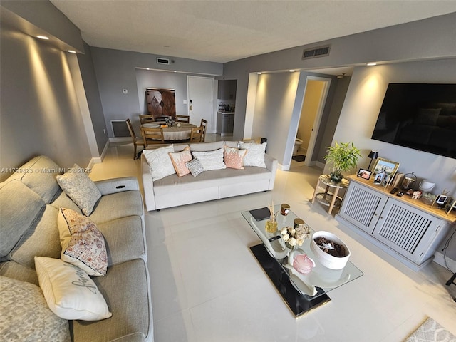 3850 Washington St Unit 704, Hollywood, FL 33021 - living room featuring baseboards
