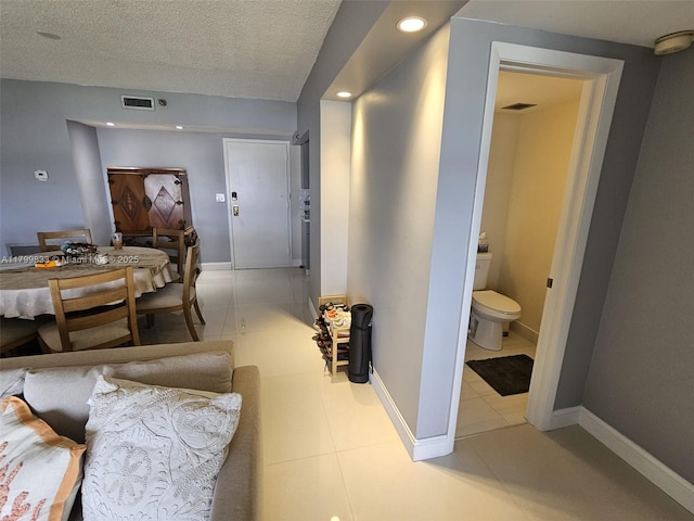 3850 Washington St Unit 704, Hollywood, FL 33021 - tiled dining room featuring recessed lighting, baseboards, and a textured ceiling
