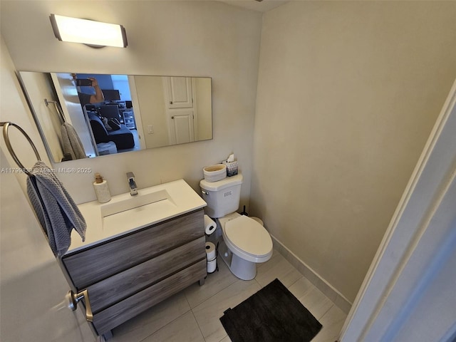 3850 Washington St Unit 704, Hollywood, FL 33021 - half bathroom featuring toilet, vanity, baseboards, and tile patterned flooring