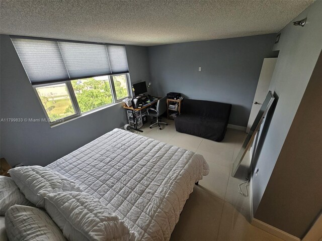 3850 Washington St Unit 704, Hollywood, FL 33021 - bedroom with a textured ceiling and a desk