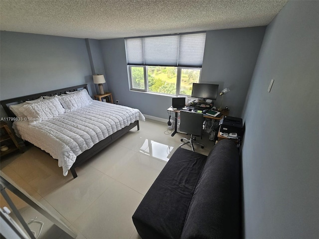3850 Washington St Unit 704, Hollywood, FL 33021 - bedroom with a textured ceiling and a desk