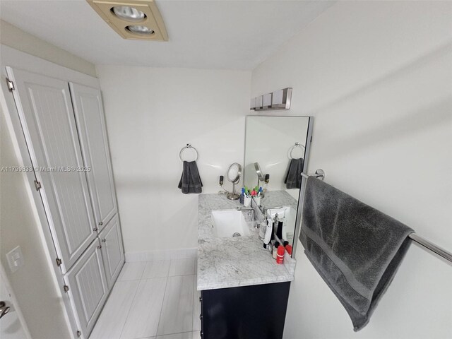 3850 Washington St Unit 704, Hollywood, FL 33021 - bathroom with vanity, tile patterned flooring, and baseboards