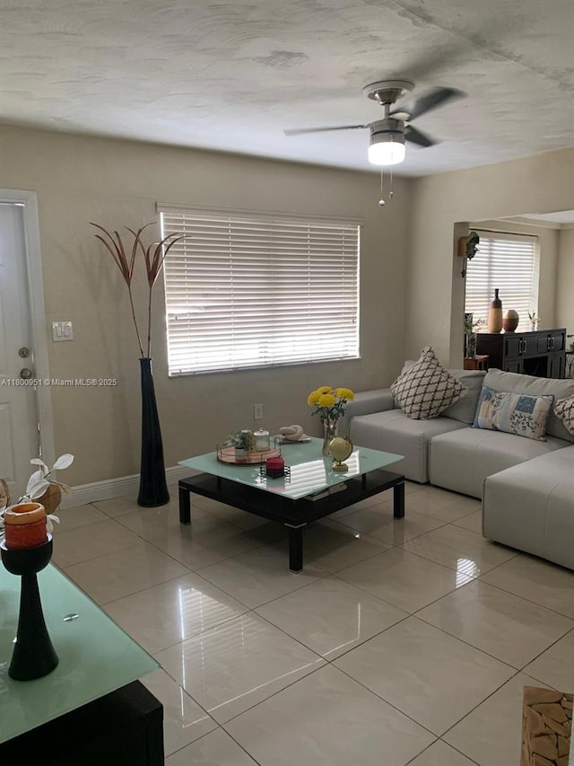 519 S 61st Ave, Hollywood, FL 33023 - living room with light tile patterned flooring, a ceiling fan, and baseboards