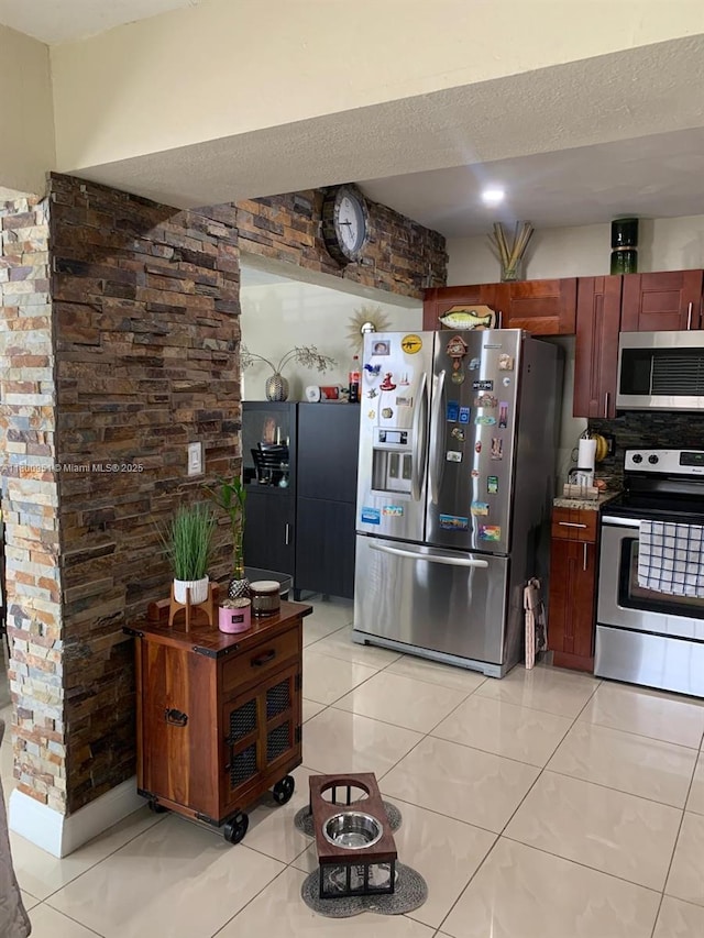 519 S 61st Ave, Hollywood, FL 33023 - kitchen with stainless steel appliances and light tile patterned floors
