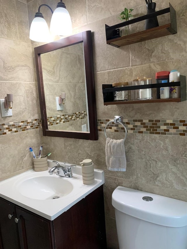 519 S 61st Ave, Hollywood, FL 33023 - half bath featuring tile walls, tasteful backsplash, vanity, and toilet