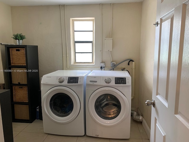519 S 61st Ave, Hollywood, FL 33023 - laundry room with washer and clothes dryer and light tile patterned floors