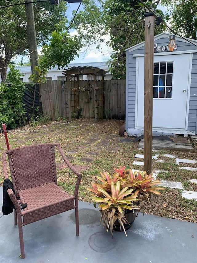 519 S 61st Ave, Hollywood, FL 33023 - view of patio / terrace with a storage shed, fence, and an outdoor structure