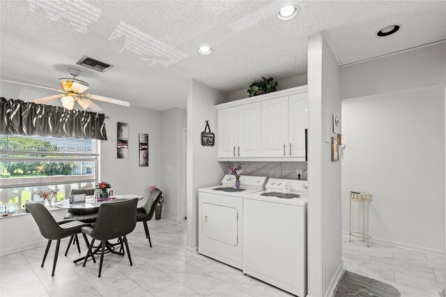 1621 NW 20th Ave Unit 203, Delray Beach, FL 33445 - laundry area with separate washer and dryer, cabinet space, a ceiling fan, a textured ceiling, and recessed lighting