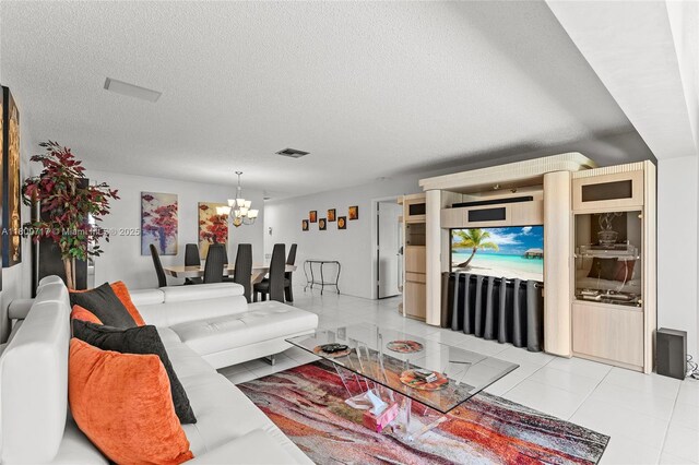 1621 NW 20th Ave Unit 203, Delray Beach, FL 33445 - bedroom with tile patterned floors, ceiling fan, and a textured ceiling