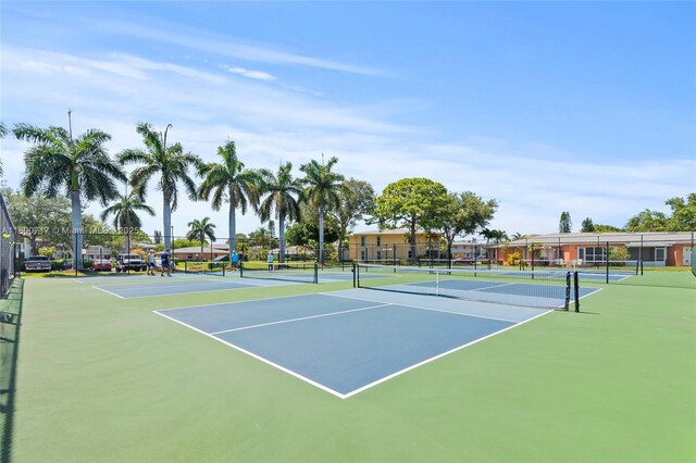 1621 NW 20th Ave Unit 203, Delray Beach, FL 33445 - bathroom with vanity, a stall shower, and decorative backsplash