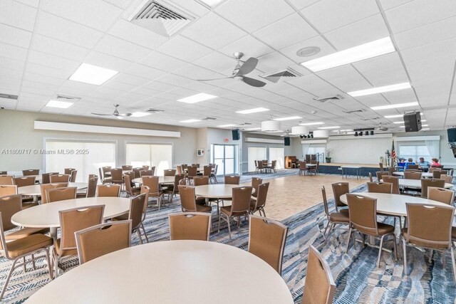 1621 NW 20th Ave Unit 203, Delray Beach, FL 33445 - dining room featuring ceiling fan and a drop ceiling