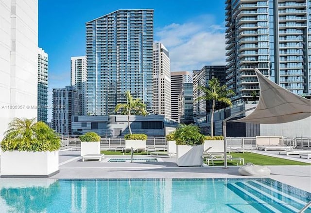 690 SW 1st Ct Unit 1227, Miami, FL 33130 - community pool featuring a city view and a patio area