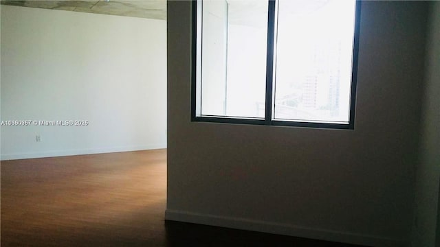 690 SW 1st Ct Unit 1227, Miami, FL 33130 - spare room with wood finished floors and baseboards