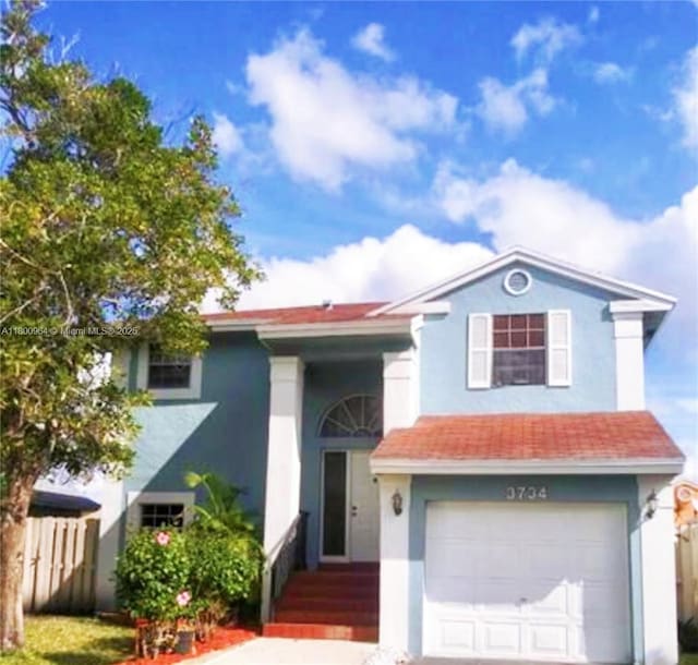 3734 NW 107th Way, Sunrise, FL 33351 - view of front of property with an attached garage and stucco siding
