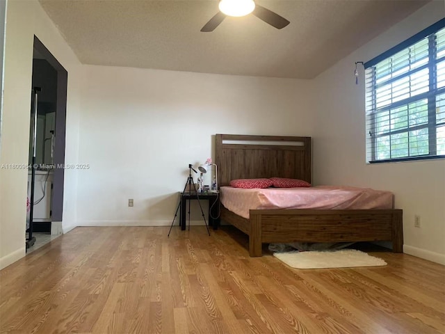 3734 NW 107th Way, Sunrise, FL 33351 - bedroom with wood finished floors, baseboards, and a ceiling fan