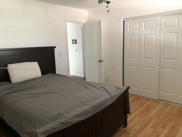 3734 NW 107th Way, Sunrise, FL 33351 - bedroom featuring light wood-style flooring, a closet, and a ceiling fan