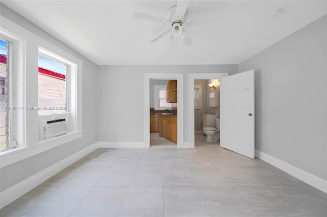 1621 Van Buren St, Hollywood, FL 33020 - unfurnished bedroom featuring a sink, baseboards, light tile patterned floors, ensuite bath, and cooling unit