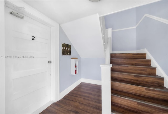 1621 Van Buren St, Hollywood, FL 33020 - stairway with wood finished floors, vaulted ceiling, and baseboards