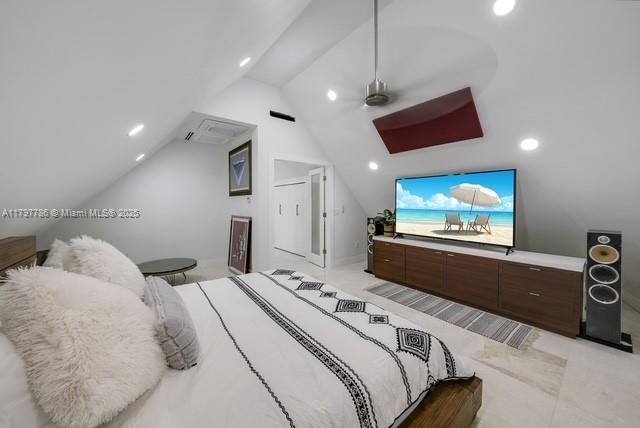bedroom featuring vaulted ceiling and recessed lighting