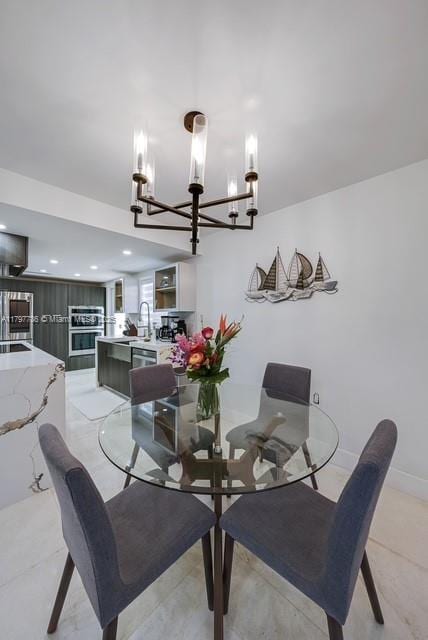 dining room featuring a chandelier and recessed lighting