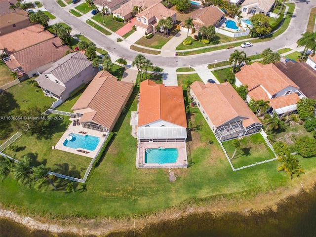 aerial view of residential area featuring a pool area