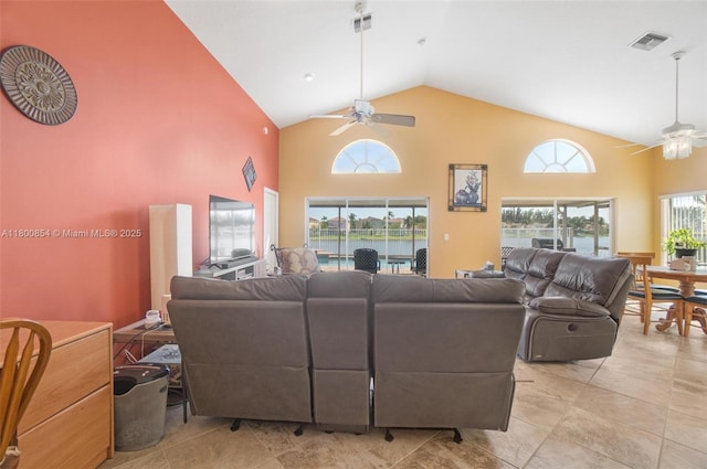 living room with ceiling fan and high vaulted ceiling