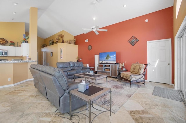 living room with high vaulted ceiling, ceiling fan, and baseboards