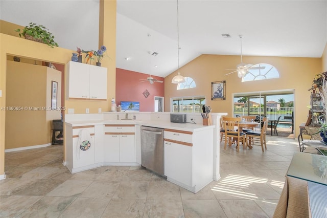 kitchen featuring stainless steel dishwasher, ceiling fan, high vaulted ceiling, light countertops, and white cabinets