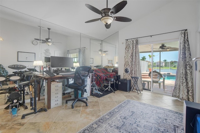 office area featuring a ceiling fan, high vaulted ceiling, and tile patterned floors
