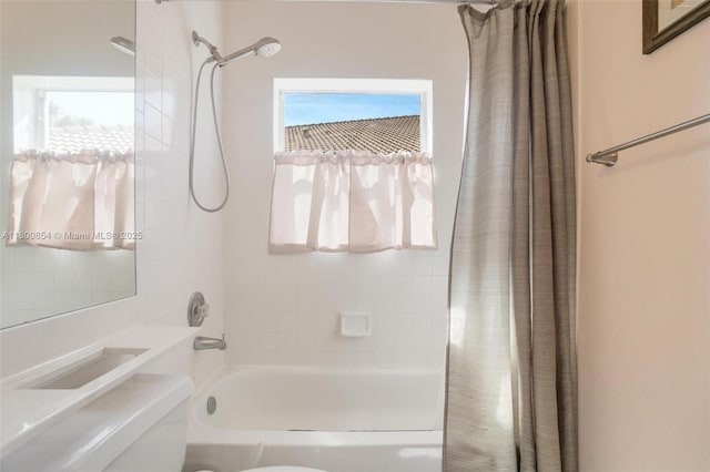 full bath with toilet and shower / tub combo