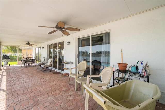 view of patio / terrace with a ceiling fan and outdoor dining space
