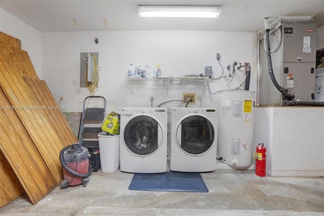 washroom featuring water heater, washer and dryer, and heating unit