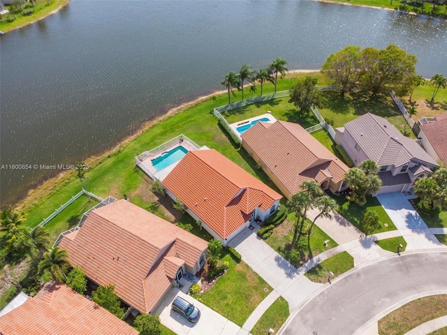 drone / aerial view of a large body of water and a pool