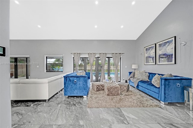 5260 NW 74th Ter, Lauderhill, FL 33319 - living room featuring marble tiled flooring, high vaulted ceiling, recessed lighting, and french doors