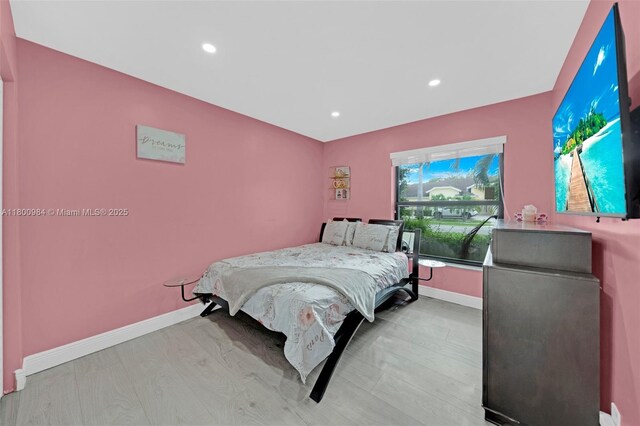 5260 NW 74th Ter, Lauderhill, FL 33319 - bedroom with baseboards, recessed lighting, and wood finished floors
