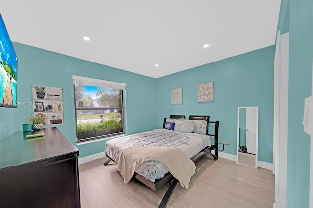 5260 NW 74th Ter, Lauderhill, FL 33319 - bedroom with light wood-style flooring, baseboards, and recessed lighting