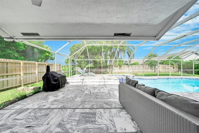 5260 NW 74th Ter, Lauderhill, FL 33319 - view of patio with a fenced backyard, a lanai, a grill, and an in-ground hot tub