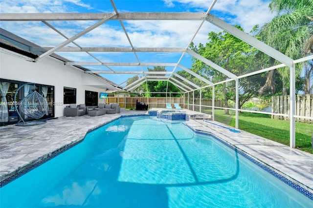 5260 NW 74th Ter, Lauderhill, FL 33319 - view of pool featuring an outdoor living space, a patio area, glass enclosure, and a pool with connected hot tub