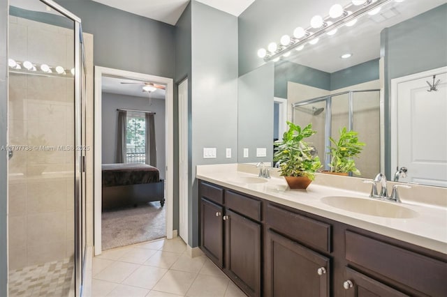 4346 Cascada Cir, Cooper City, FL 33024 - ensuite bathroom with a stall shower, tile patterned flooring, and double vanity