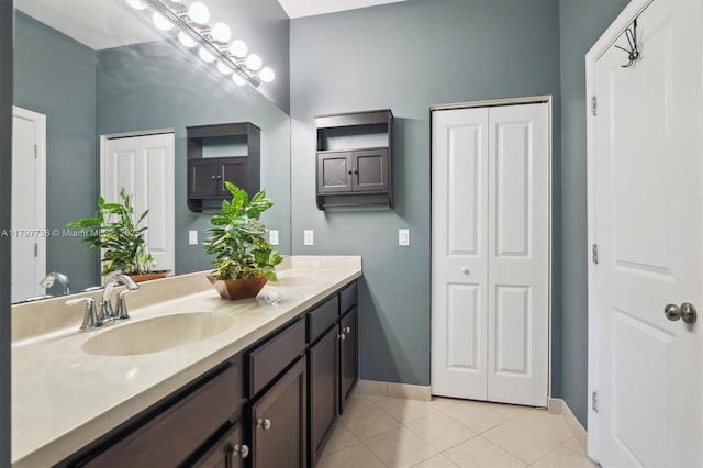4346 Cascada Cir, Cooper City, FL 33024 - full bathroom featuring tile patterned floors, baseboards, double vanity, and a closet
