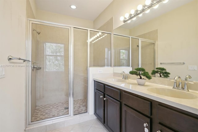 4346 Cascada Cir, Cooper City, FL 33024 - bathroom with a stall shower, double vanity, tile patterned floors, and recessed lighting