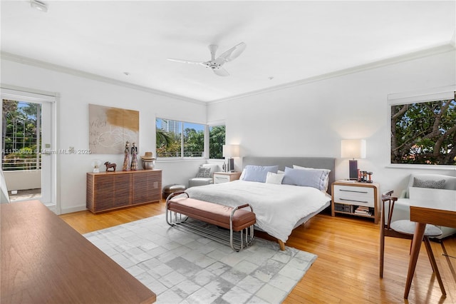 4532 Sheridan Ave, Miami Beach, FL 33140 - bedroom featuring crown molding, multiple windows, light wood-style floors, and a ceiling fan