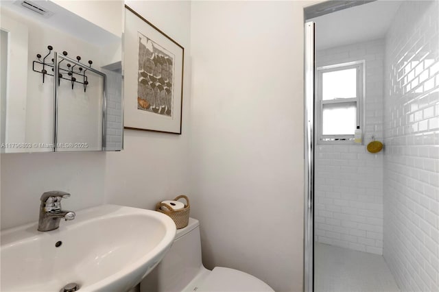 4532 Sheridan Ave, Miami Beach, FL 33140 - bathroom featuring a sink, a shower stall, and toilet