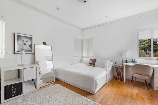4532 Sheridan Ave, Miami Beach, FL 33140 - bedroom with light wood-style floors and ornamental molding