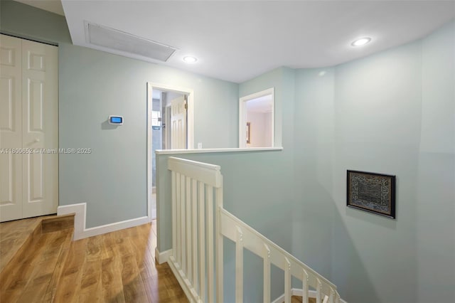 11235 Lakeview Dr Unit 13-D, Coral Springs, FL 33071 - corridor with an upstairs landing, light wood-type flooring, attic access, baseboards, and recessed lighting