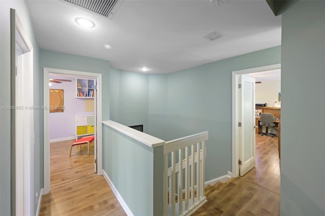 11235 Lakeview Dr Unit 13-D, Coral Springs, FL 33071 - corridor with an upstairs landing, a desk, wood finished floors, baseboards, and recessed lighting